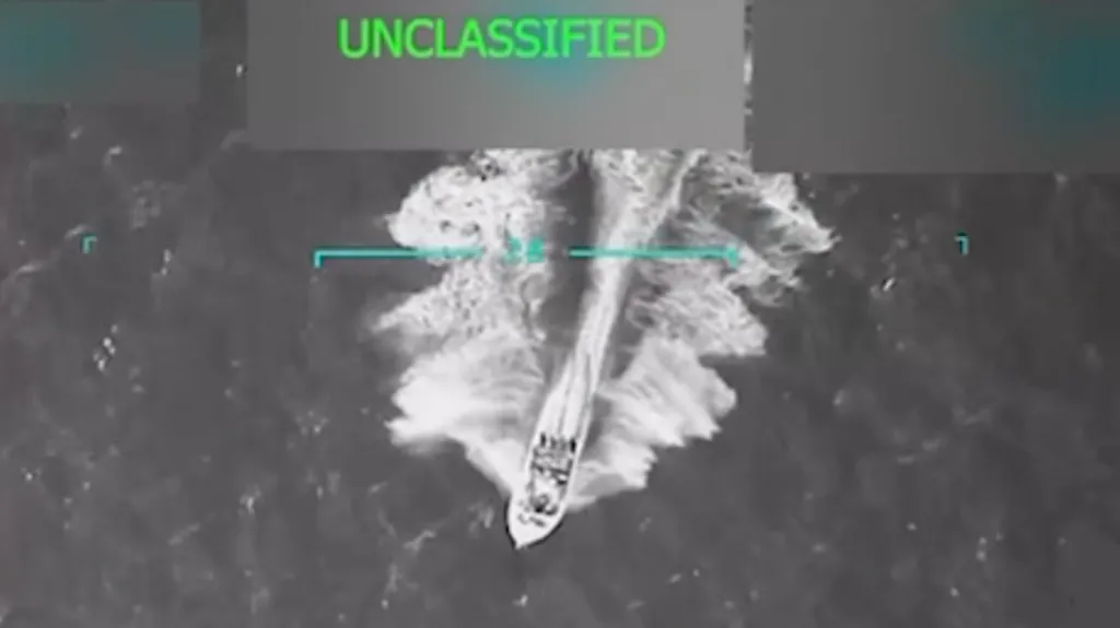 Image of the boat moments before the attack released by Donald Trump on Truth Social. Trump claims 'bags of drugs were all over the boat' but that does not seem to be clear from any of the photos.